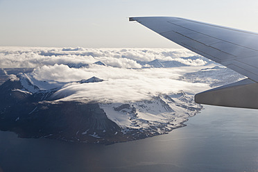 View of snow-capped mountains in Spitsbergen, Norway, captured from a flight over Europe - FOF003698