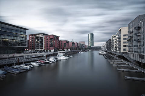 Germany, Hesse, Frankfurt, View of Westhafen harbor with city stock photo