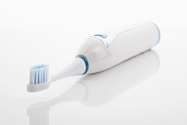 Electric toothbrush on white background, close up - MAEF004022