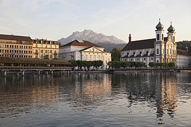Switzerland, Lucerne, View of church with River Reuss and mountain in background - MSF002479
