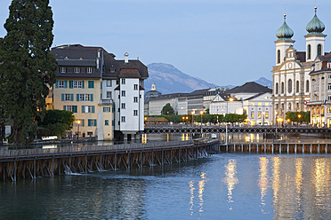 Switzerland, Lucerne, View of church with River Reuss and mountain in background - MSF002482