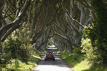 United Kingdom, Northern Ireland, County Antrim, View of car on road - SIEF002129