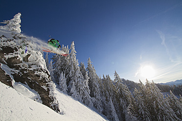 Austria, Tirol, Kitzbuehel, Man doing ski jumping - FFF001254
