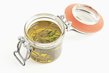 Rosemary with olive oil in glass jar - MAEF004039