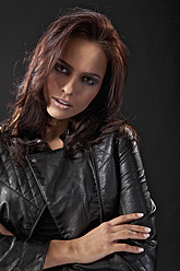 Young woman in black dress and leather jacket, portrait - MAEF004133