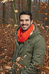 Germany, Berlin, Wandlitz, Young man smiling, portrait - WESTF018269