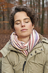 Germany, Berlin, Wandlitz, Mid adult woman with eyes closed, close up - WESTF018272