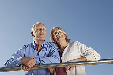 Spain, Mallorca, Senior couple looking up, smiling - SKF000799