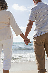 Spain, Mallorca, Senior couple looking at view on beach - SKF000848