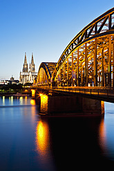 Germany, Cologne, View of Cologne Cathedral and Hohenzollern Bridge with River Rhine - FO003817