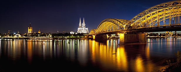 Germany, Cologne, View of Cologne Cathedral and Hohenzollern Bridge with River Rhine - FOF003818