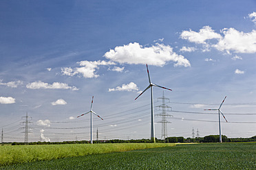 Germany, Bavaria, View of wind turbine and electricity pylon - FOF003866