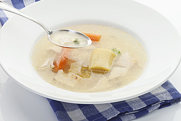 https://us.images.westend61.de/0000148309j/chicken-soup-in-plate-with-spoon-on-napkin-close-up-MAEF004319.jpg