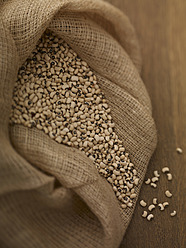 Sack of black eye beans on table, close up - SRSF000221