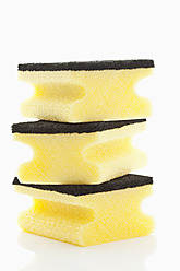 Stack of sponges on white background, close up - MAEF004390