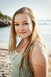 Spain, Mallorca, Teenage girl on beach, smiling, portrait - MFPF000002