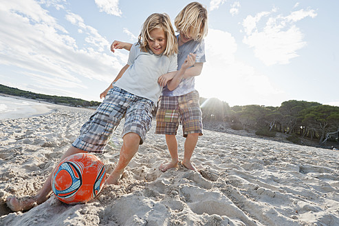 Spain, Mallorca, Children playing soccer on beach - MFPF000084