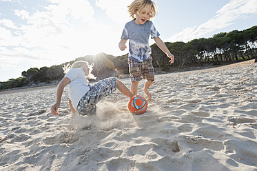 Spain, Mallorca, Children playing soccer on beach - MFPF000085