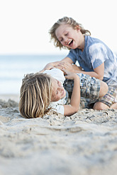 Spain, Mallorca, Children playing on beach - MFPF000098