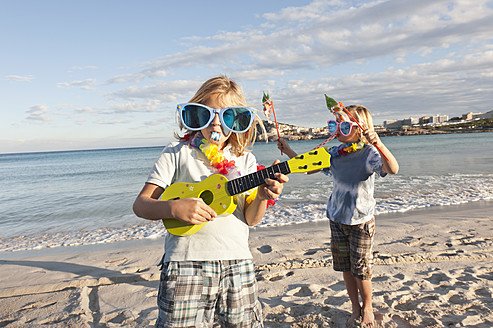 Spain, Mallorca, Children playing on beach - MFPF000100