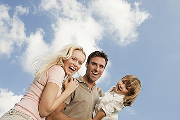 Spain, Mallorca, Palma, Family standing together, smiling, portrait - SKF000907