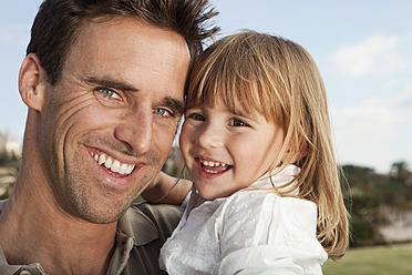 Spain, Mallorca, Palma, Father and daughter smiling, close up - SKF000908