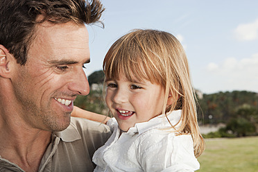 Spain, Mallorca, Palma, Father and daughter smiling, close up - SKF000909