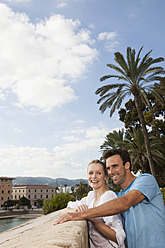 Spain, Mallorca, Palma, Couple looking away, smiling - SKF000930