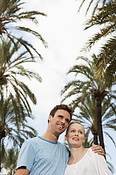 Spain, Mallorca, Palma, Couple looking away, smiling - SKF000946
