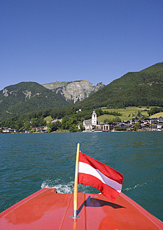 Austria, Boat with flag in Wolfgangsee Lake - WWF001968