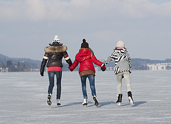 Austria, Teenage girls doing ice skating - WWF002293