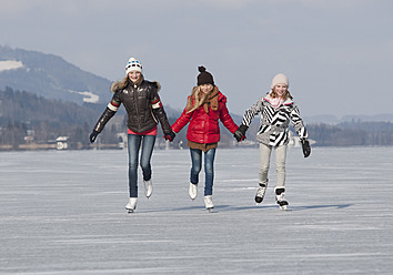 Austria, Teenage girls doing ice skating - WWF002294