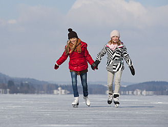 Austria, Teenage girls doing ice skating - WWF002295