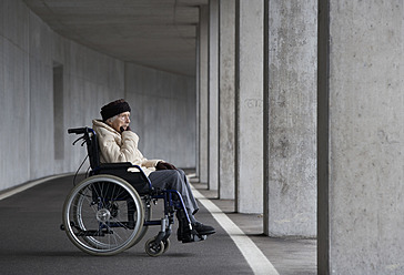 Austria, Senior woman on wheelchair at Subway - WWF002028