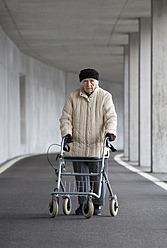 Austria, Senior woman with wheeled walker at Subway - WWF002033