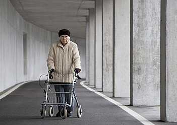 Austria, Senior woman with wheeled walker at Subway - WWF002034