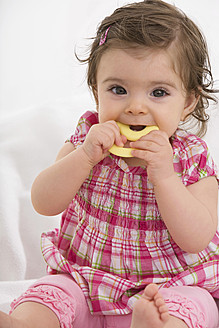 Baby girl carrying dummy in mouth - SMOF000465