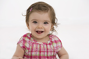 Close up of baby girl, smiling - SMOF000469