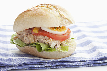 Tuna sandwich on napkin, close up - MAEF004439