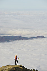 Germany, Bavaria, Walchesee Region, Hiker on mountain - MIRF000360