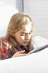 Germany, Leipzig, Girl using digital tablet - WESTF018400