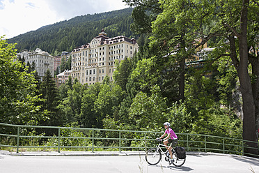 Austria, Salzburger Land , Mid adult woman riding bicycle - DSF000261