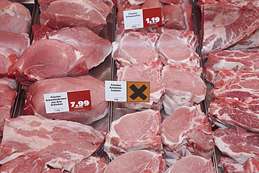 Germany, Fresh meat at counter - THF001175