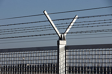 Germany, Frankfurt, View of security fence at airport - THF001148