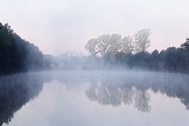 Germany, Bavaria, View of foggy lake - SIEF002362