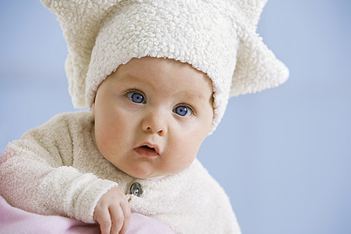 Baby girl in star shape hat, portrait - SMOF000515