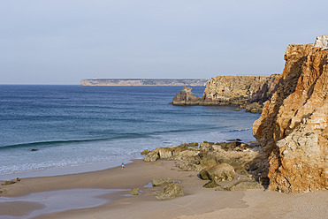 Portugal, Algarve, Senior woman jogging by coast - MIRF000374