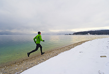 Germany, Mature man jogging by Walchensee Lake - MIRF000378