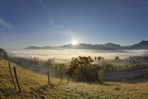 Germany, Bavaria, Kleinweil, View of village in fog stock photo