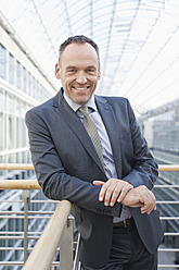 Germany, Leipzig, Businessman smiling, portrait - WESTF018554